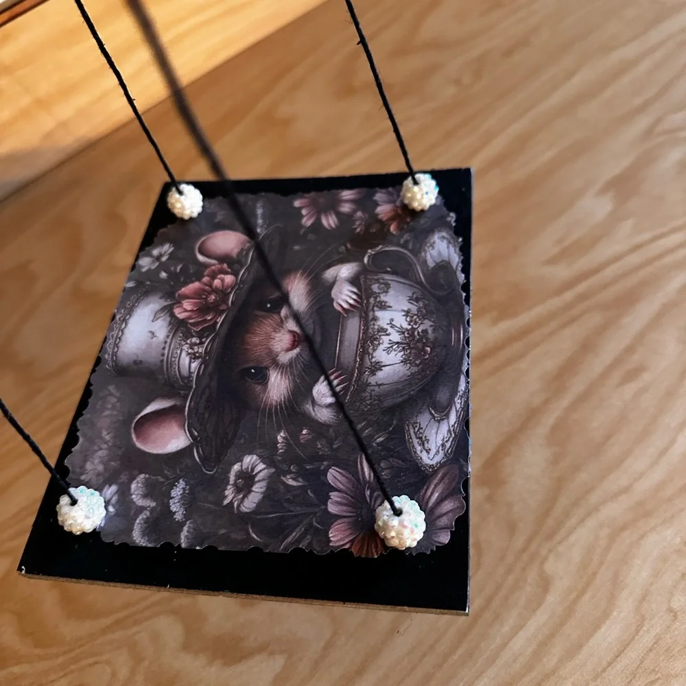 Handmade hanging display shelf with vintage mouse and teacup art